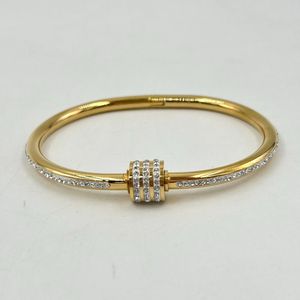 Bracelet manchette en acier inoxydable doré incrustation de cristaux