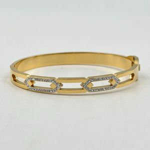 Bracelet manchette en acier inoxydable doré incrustation de cristaux