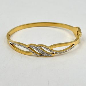 Bracelet manchette en acier inoxydable doré incrustation de cristaux