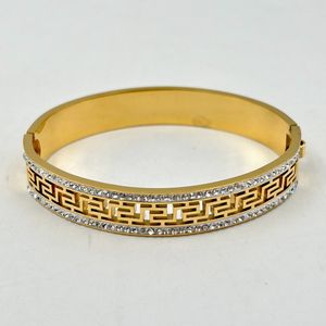 Bracelet manchette en acier inoxydable doré incrustation de cristaux