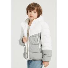 Doudoune bouffante avec capuche et matelassage en bandes