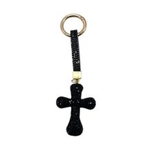 Porte-clés en forme de croix recouverte de strass étincelants