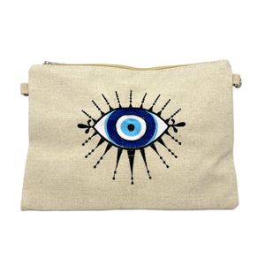 Petite trousse à motif "œil" avec une bandoulière amovible