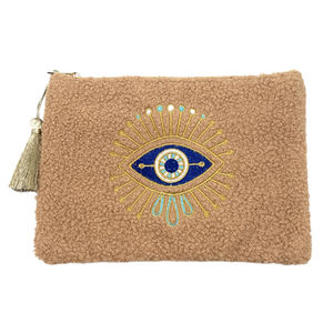 Petite trousse moutonnée avec un motif central brodé d'un œil