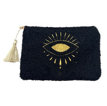 Petite trousse moutonnée avec un motif central brodé d'un œil