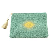 Petite trousse moutonnée avec un motif central brodé d'un œil