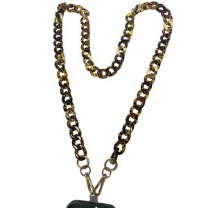 Chaîne bijou pour téléphone ornée d’un motif écaille de tortue