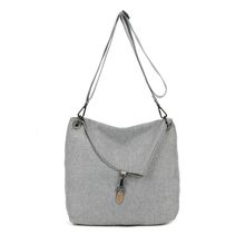 Sac bandoulière réalisé en toile avec rabat asymétrique