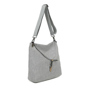 Sac bandoulière réalisé en toile avec rabat asymétrique