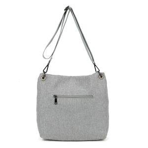 Sac bandoulière réalisé en toile avec rabat asymétrique