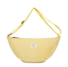 Sac bandoulière réalisé en toile et fermeture à glissière