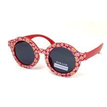 Lunettes de soleil fille de forme ronde ornée d'un motif floral joyeux