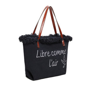 Cabas zippé "Libre comme l'air" et un oiseau accentué par des franges