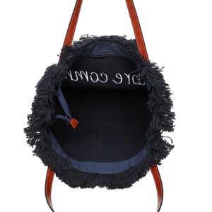 Cabas zippé "Libre comme l'air" et un oiseau accentué par des franges