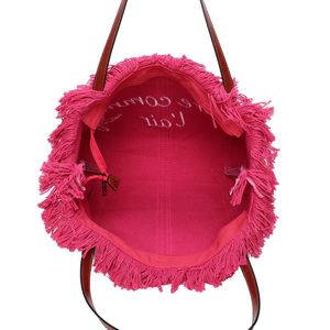 Cabas zippé "Libre comme l'air" et un oiseau accentué par des franges