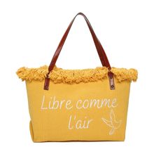 Cabas zippé "Libre comme l'air" et un oiseau accentué par des franges