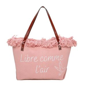 Cabas zippé "Libre comme l'air" et un oiseau accentué par des franges