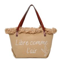 Cabas zippé "Libre comme l'air" et un oiseau accentué par des franges