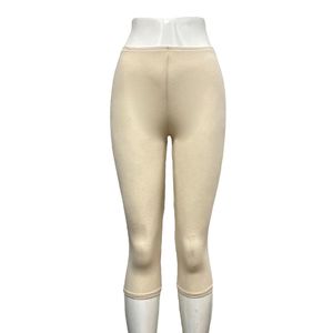 Legging court réalisé en viscose extensible d'une couleur unie