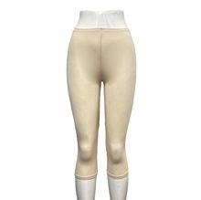 Legging court réalisé en viscose extensible d'une couleur unie