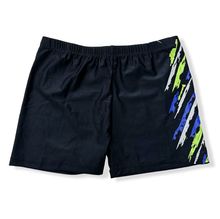 Short de bain court uni à motif graphique abstrait sur le côté droit