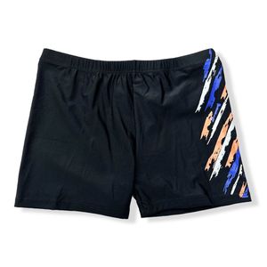 Short de bain court uni à motif graphique abstrait sur le côté droit