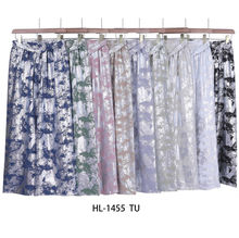 Pantalon élégant de coupe palazzo à reflets argent métallisés