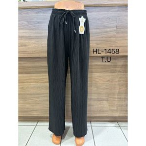 Pantalon fluide palazzo plissé et froissé créant un effet ondulé