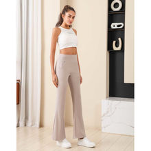 Pantalon évasé/bootcut doté d'une taille haute à bande large