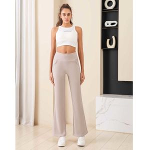 Pantalon évasé/bootcut doté d'une taille haute à bande large