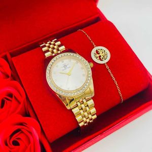 Coffret rouge : montre arrondie sertis de strass  doré + bracelet en acier