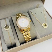 Coffret taupe : montre arrondie sertis de strass  doré + bijoux en acier