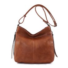 Besace en cuir synthétique avec des zips latéraux décoratifs