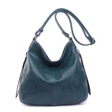 Besace en cuir synthétique avec des zips latéraux décoratifs