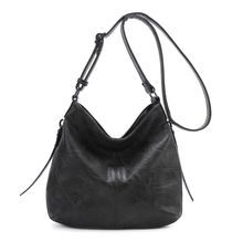 Besace en cuir synthétique avec des zips latéraux décoratifs