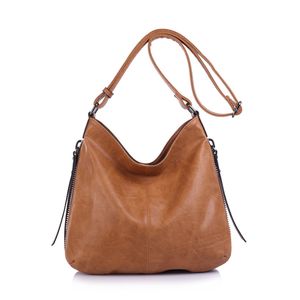 Besace en cuir synthétique avec des zips latéraux décoratifs