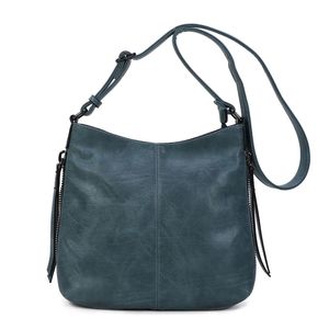 Besace en cuir synthétique avec des zips latéraux décoratifs