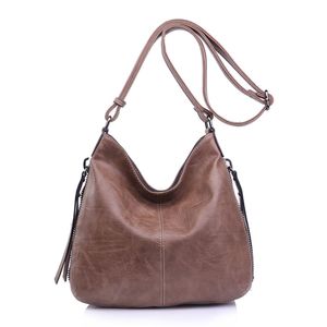 Besace en cuir synthétique avec des zips latéraux décoratifs