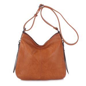 Besace en cuir synthétique avec des zips latéraux décoratifs