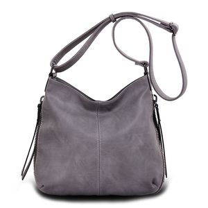 Besace en cuir synthétique avec des zips latéraux décoratifs