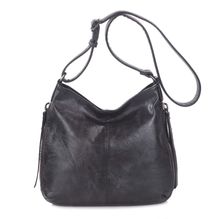 Besace en cuir synthétique avec des zips latéraux décoratifs