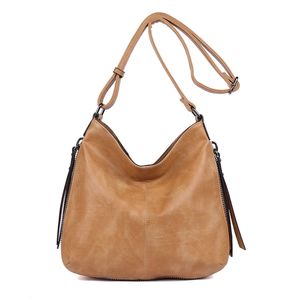 Besace en cuir synthétique avec des zips latéraux décoratifs