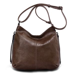 Besace en cuir synthétique avec des zips latéraux décoratifs