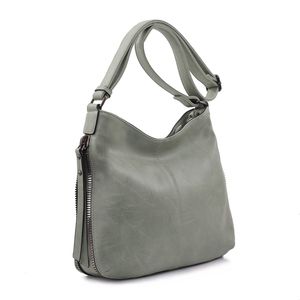 Besace en cuir synthétique avec des zips latéraux décoratifs