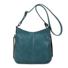 Besace en cuir synthétique avec des zips latéraux décoratifs