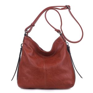 Besace en cuir synthétique avec des zips latéraux décoratifs