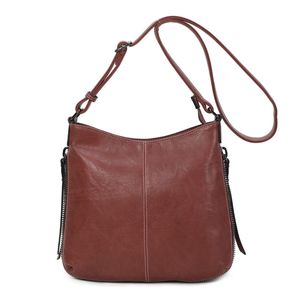 Besace en cuir synthétique avec des zips latéraux décoratifs