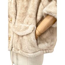 Veste en fausse fourrure au toucher très doux avec poches décoratives