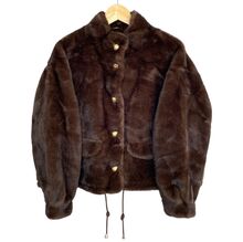 Veste en fausse fourrure au toucher très doux avec poches décoratives