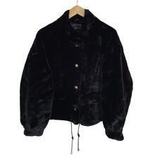 Veste en fausse fourrure au toucher très doux avec poches décoratives